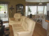 MLS # 323952: OPEN CONCEPT LIVING & DINING ROOM SURROUNDED BY WINDOWS