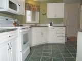 MLS # 323952: KITCHEN IS BRIGHT WITH WINDOW & SKYLIGHTS