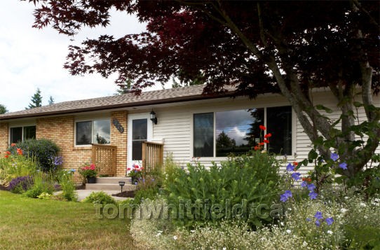 Photo of single family home on Tamarck Drive in Qualicum Beach, BC