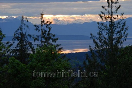 Photo of mainland mountains across Straight of Georgia